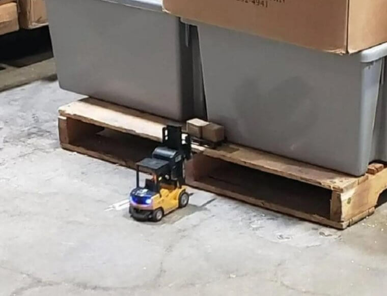 This Guy's Supervisor Bought a Mini Forklift to Drop off Mini Wood Palettes